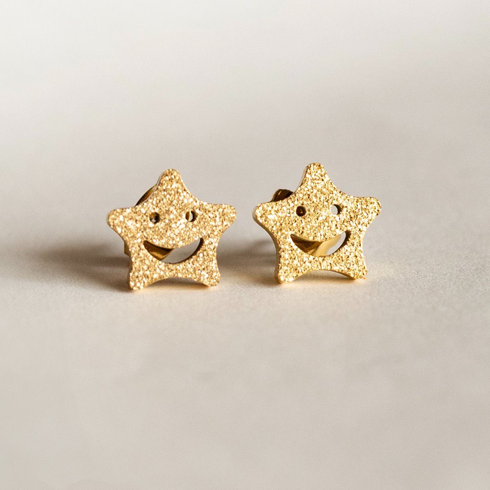 Smiling star glitter earring