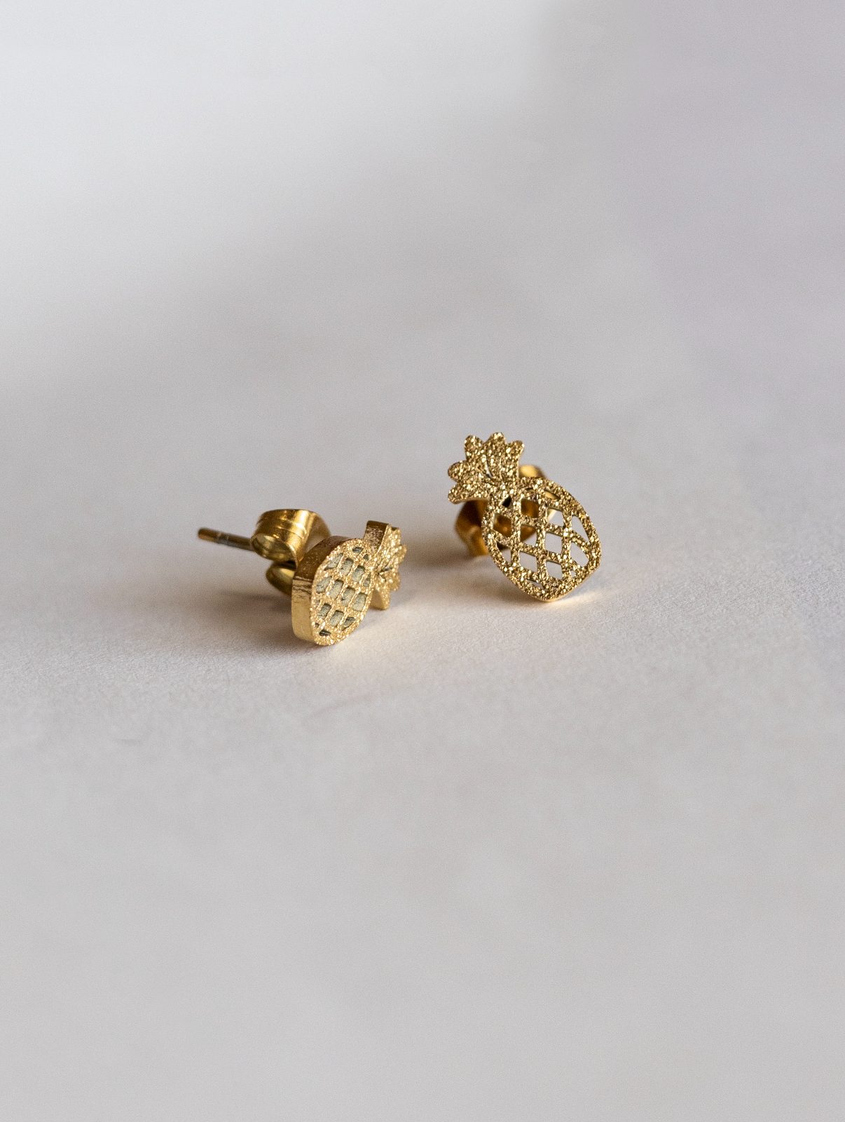 Gold pineapple glitter earring